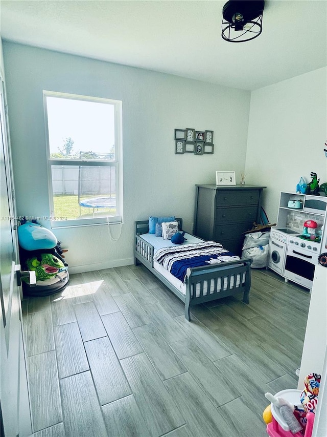 bedroom with hardwood / wood-style floors