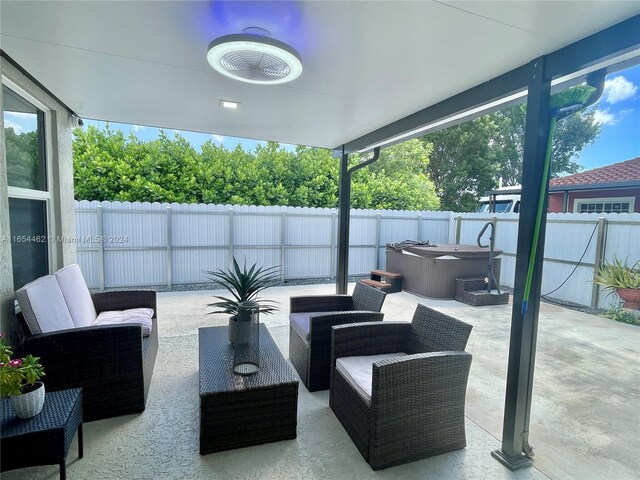 view of patio / terrace featuring a hot tub and outdoor lounge area