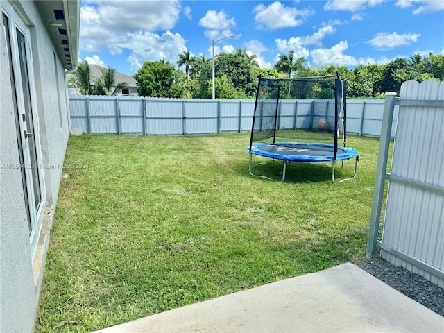 view of yard with a trampoline