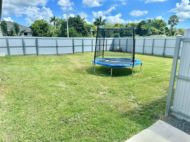 view of yard with a trampoline