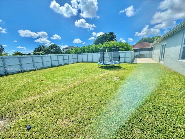 view of yard featuring a trampoline