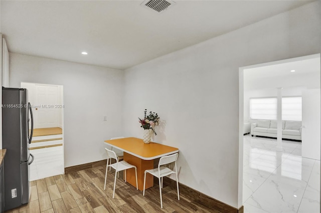 dining space featuring hardwood / wood-style flooring