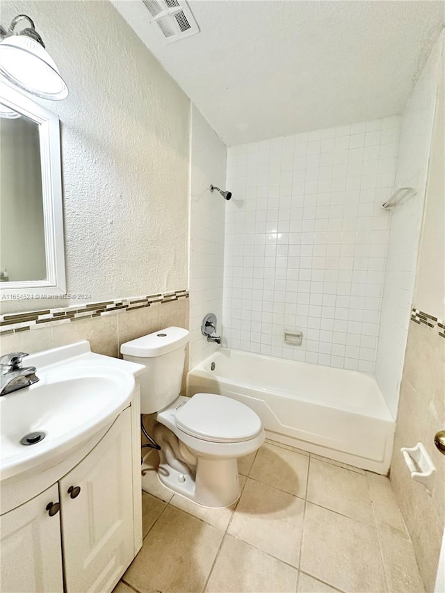 8650 SW 67th Ave Unit 1032, Pinecrest, FL 33156 - full bath featuring vanity, a textured wall, toilet, tile walls, and bathtub / shower combination