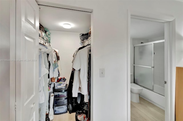 spacious closet featuring light hardwood / wood-style floors