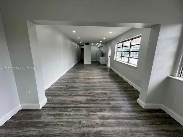 unfurnished room featuring dark hardwood / wood-style flooring