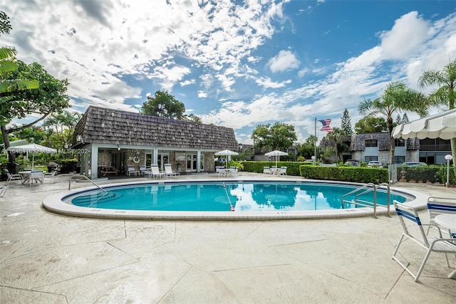 view of swimming pool featuring a patio area