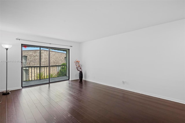 empty room featuring dark wood-type flooring