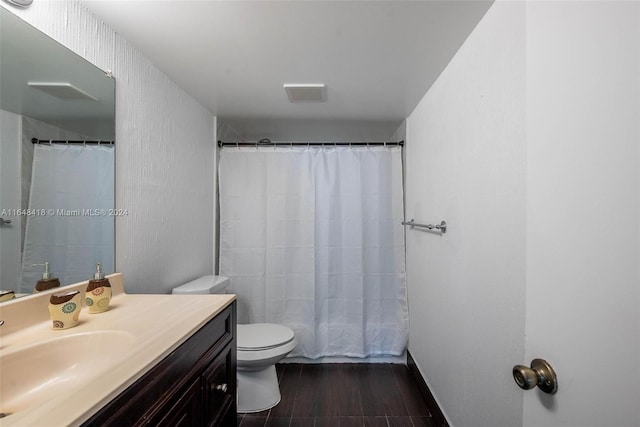 bathroom featuring vanity, toilet, a shower with curtain, and hardwood / wood-style floors