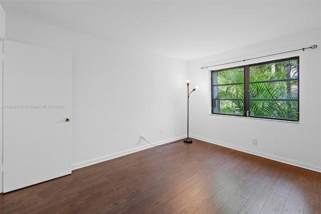 unfurnished room featuring dark hardwood / wood-style floors