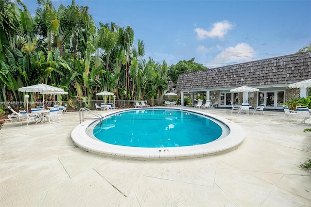 view of swimming pool with a patio area