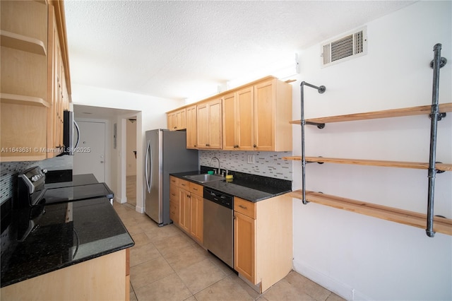 kitchen featuring open shelves, visible vents, light brown cabinetry, appliances with stainless steel finishes, and a sink