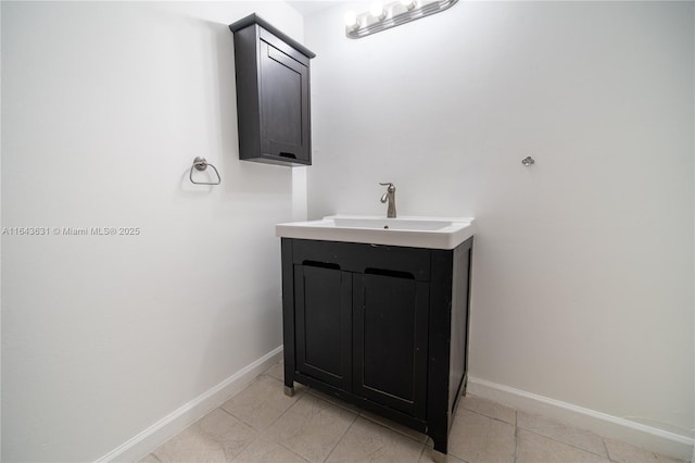 bathroom featuring vanity and baseboards