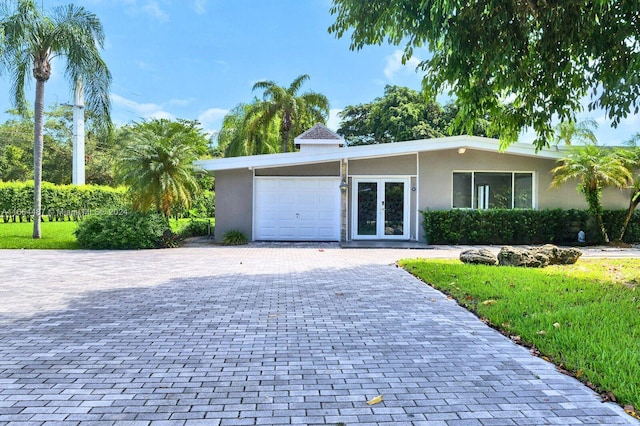 ranch-style home with a garage