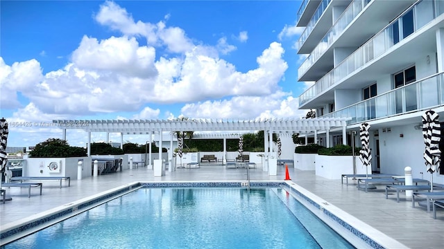 view of swimming pool with a pergola and a patio