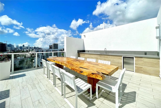 view of patio / terrace featuring sink and wine cooler