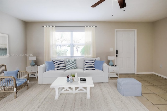 tiled living room featuring ceiling fan