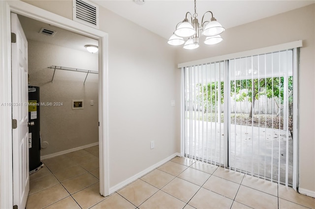 unfurnished room featuring secured water heater, a chandelier, and light tile patterned flooring