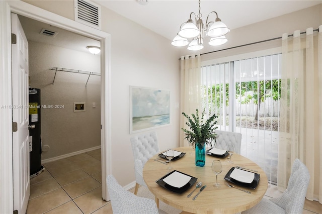 tiled dining area with an inviting chandelier and secured water heater