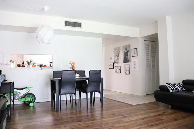 dining room with dark wood-type flooring