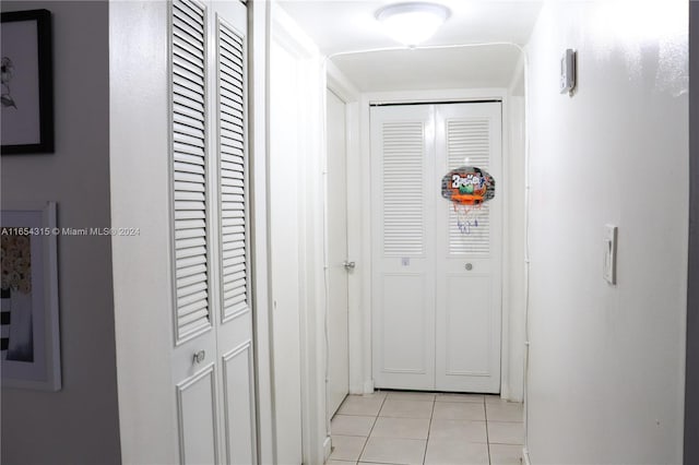 hallway with light tile patterned flooring