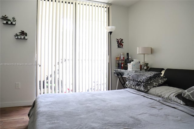 bedroom with wood-type flooring