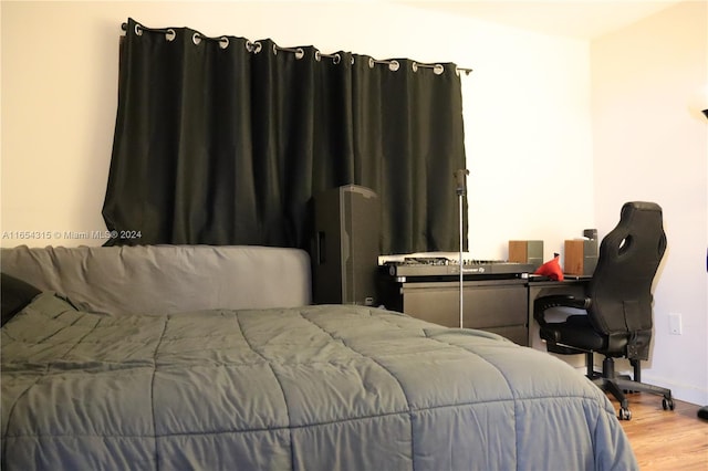 bedroom with wood-type flooring