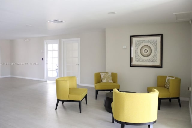 living area featuring light hardwood / wood-style floors