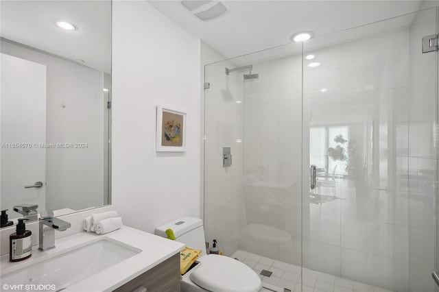 bathroom with vanity, toilet, and walk in shower