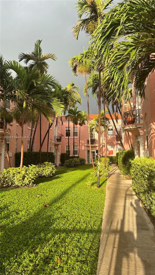 view of home's community featuring a lawn