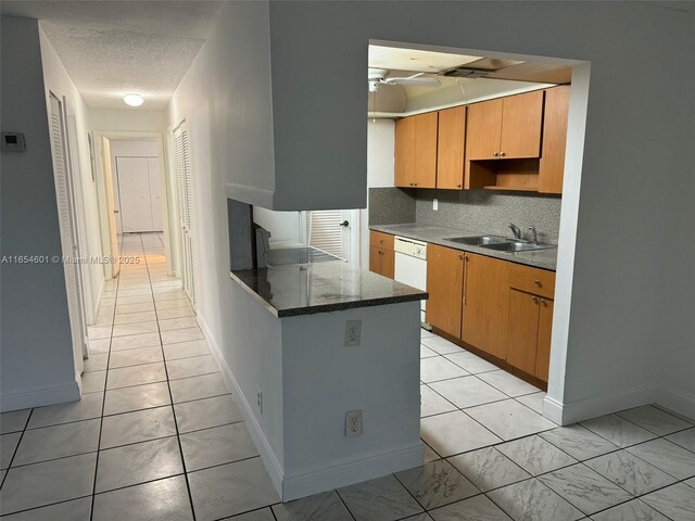 kitchen featuring white appliances and light tile patterned flooring