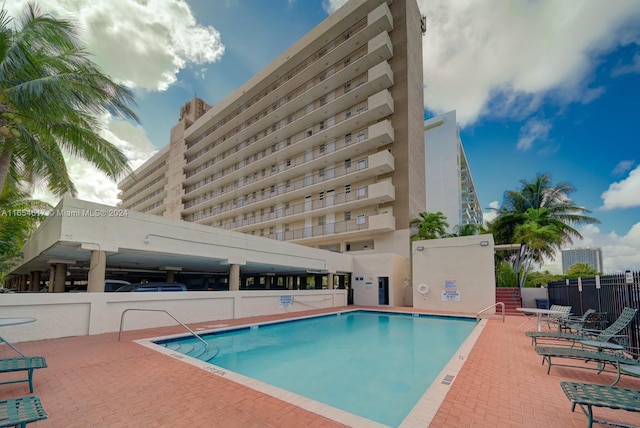 view of swimming pool featuring a patio area