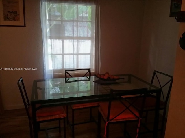 dining space with hardwood / wood-style flooring and plenty of natural light