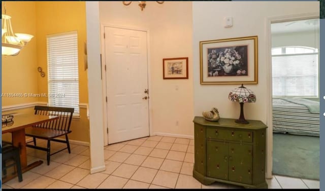 entryway featuring light tile patterned floors