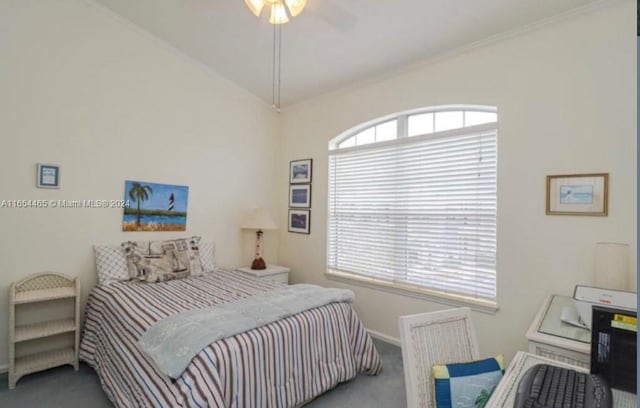 bedroom featuring lofted ceiling, crown molding, ceiling fan, and carpet floors