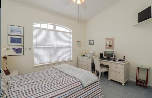 carpeted bedroom with crown molding, ceiling fan, and vaulted ceiling