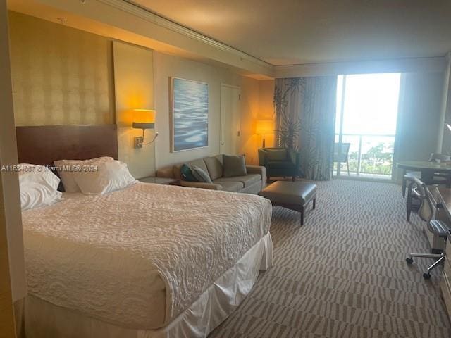 carpeted bedroom featuring ornamental molding