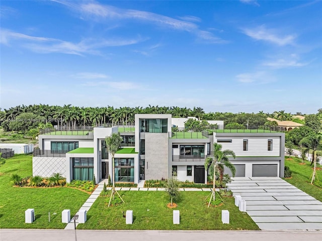 modern home with a garage and a front yard