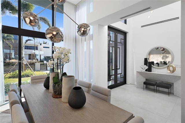 dining room with a high ceiling