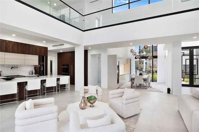 living room featuring a towering ceiling