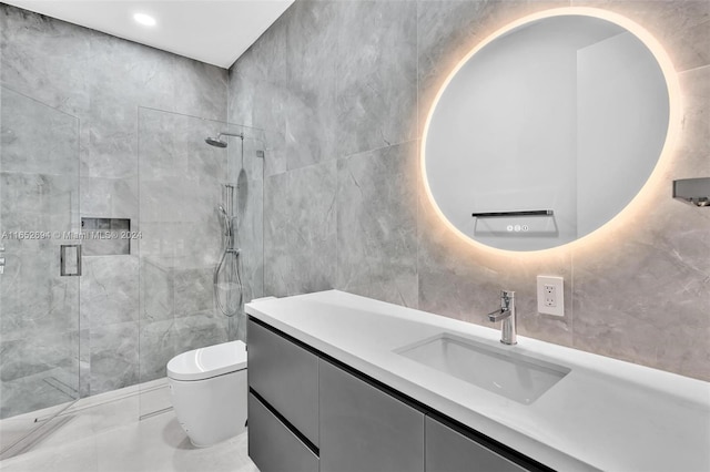 bathroom featuring walk in shower, vanity, tile walls, and toilet