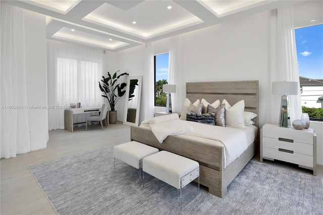 bedroom with beam ceiling, multiple windows, light hardwood / wood-style flooring, and coffered ceiling