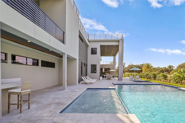 view of pool featuring a patio area