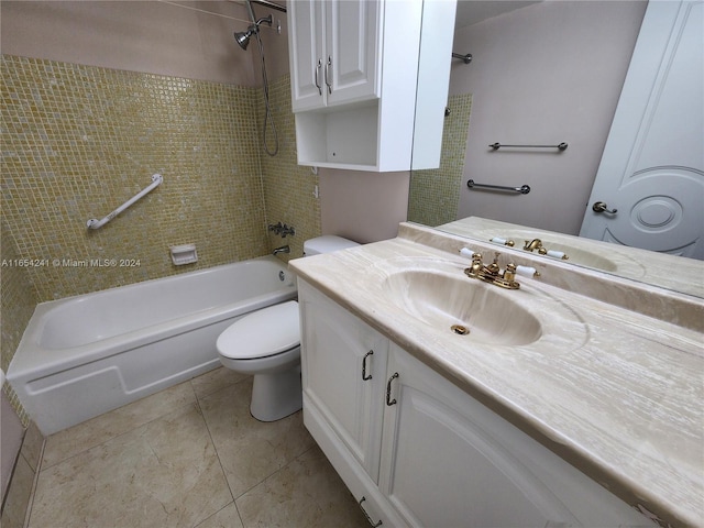 bathroom featuring tile patterned flooring, toilet, shower / bathing tub combination, and vanity