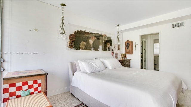 bedroom featuring visible vents and baseboards