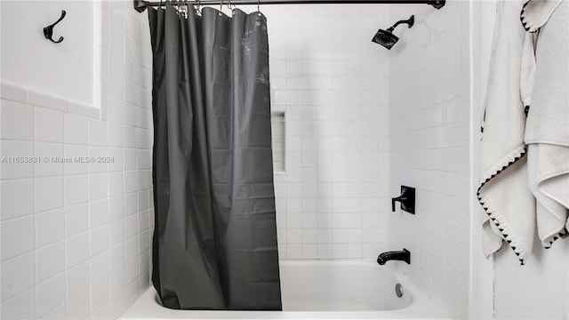 bathroom featuring shower / bath combo with shower curtain