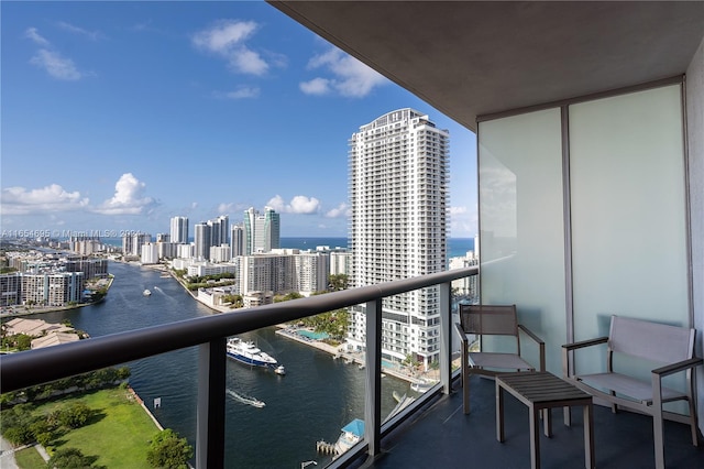 balcony featuring a water view