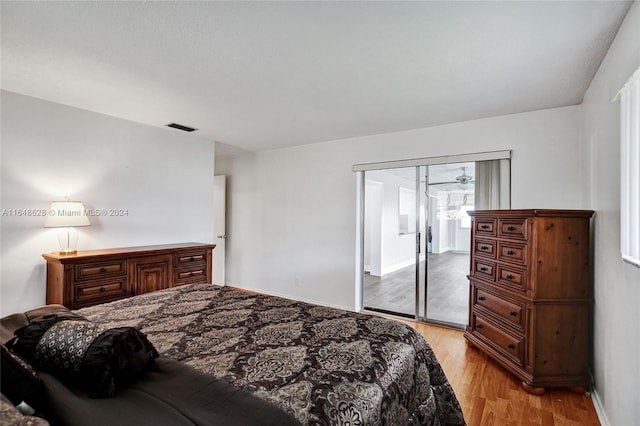 bedroom with a closet and light hardwood / wood-style floors