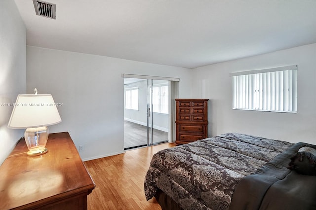 bedroom featuring a closet and light hardwood / wood-style floors