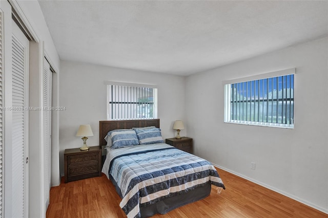 bedroom with hardwood / wood-style floors