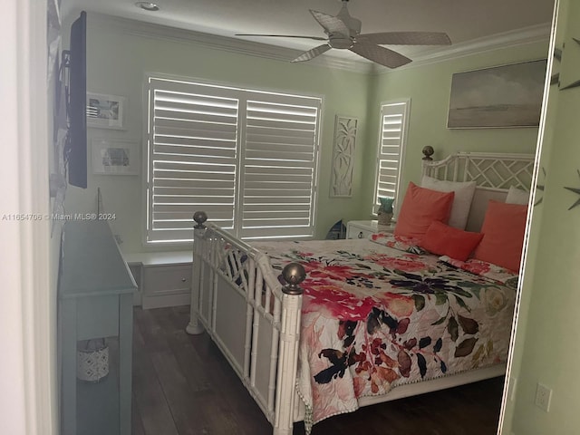 bedroom featuring ceiling fan, dark hardwood / wood-style flooring, and ornamental molding